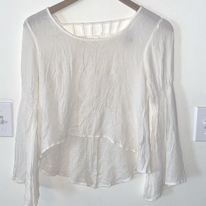 White crop top with flare sleeves and strapped back